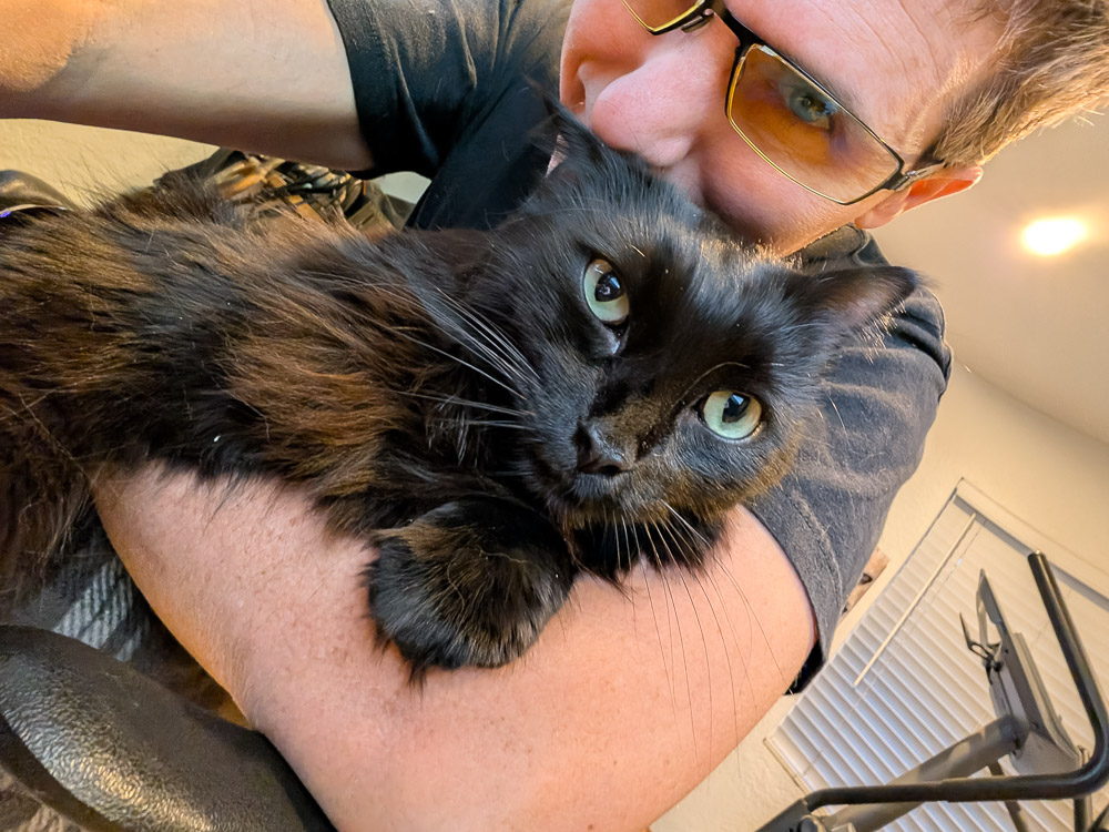 Robby with Poe, his black cat